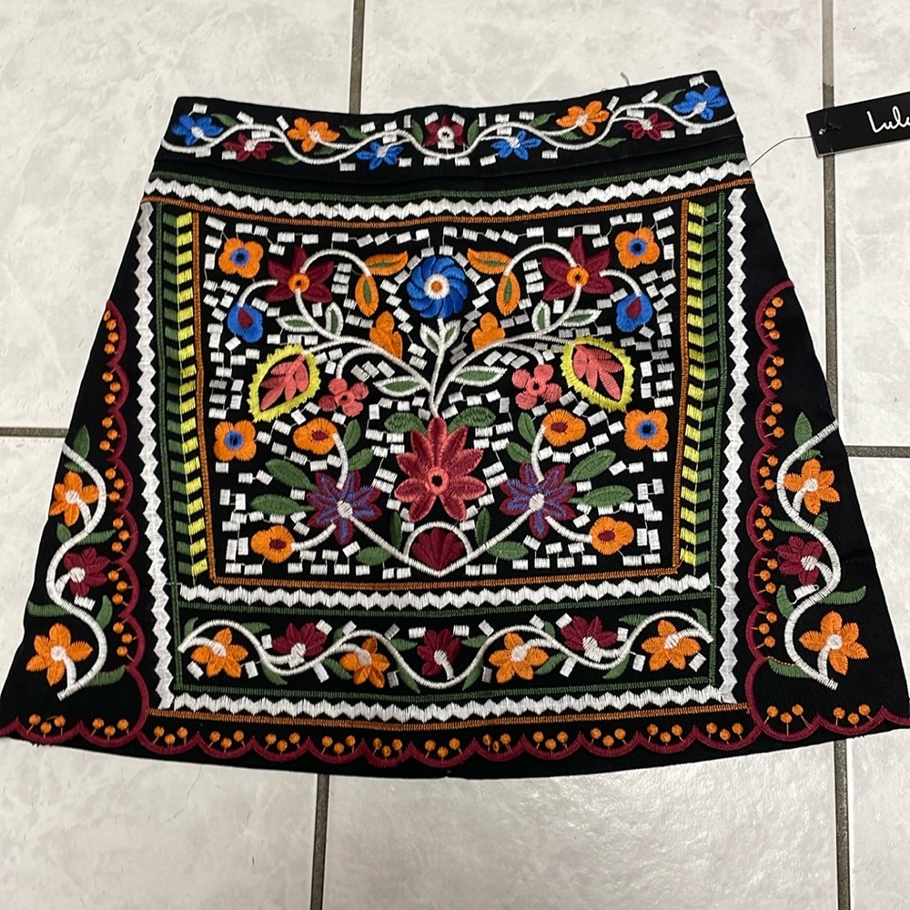 Don't Stop the Party Black Embroidered Mini Skirt
Lulus